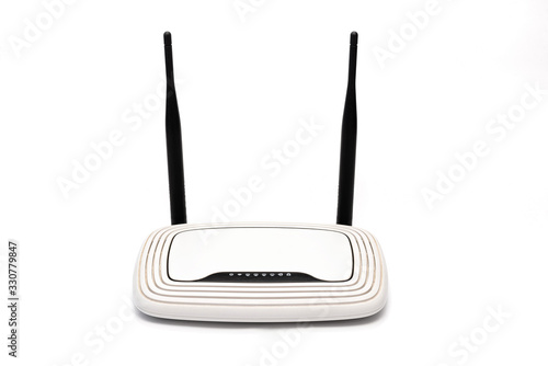 white wi-fi router with black antennas on a white background