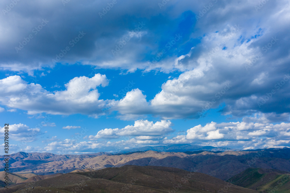 Dramatic aerial view of clouds over mountains in Arvin California Dramatic aerial view of clouds over mountains in Arvin California