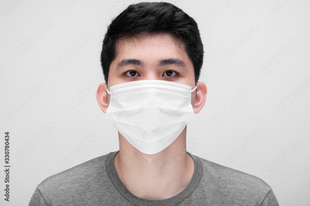 Young men with face mask isolated on white background to prevent coronavirus & PM 2.5 air pollution, Men demonstrate how to wear virus protective face mask, Coronavirus 2019-nCoV from China.