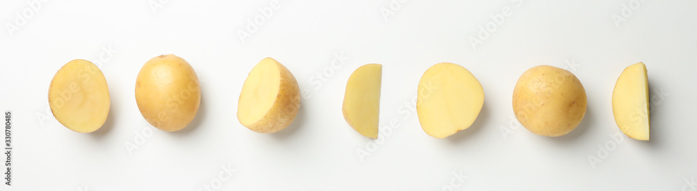 Young potato on white background, top view. Horizontal photo