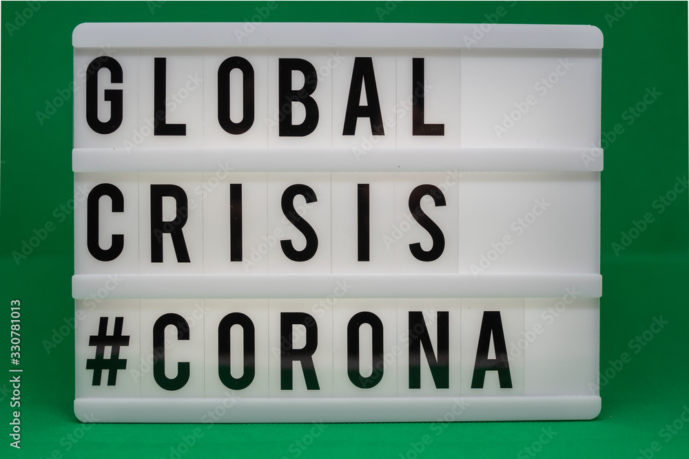 Fototapeta premium a light box with the inscription: GLOBAL CRISIS #CORONA