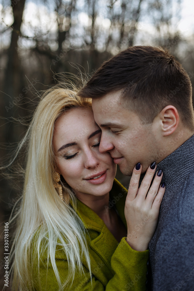 Fototapeta premium boy and girl cuddling in the park