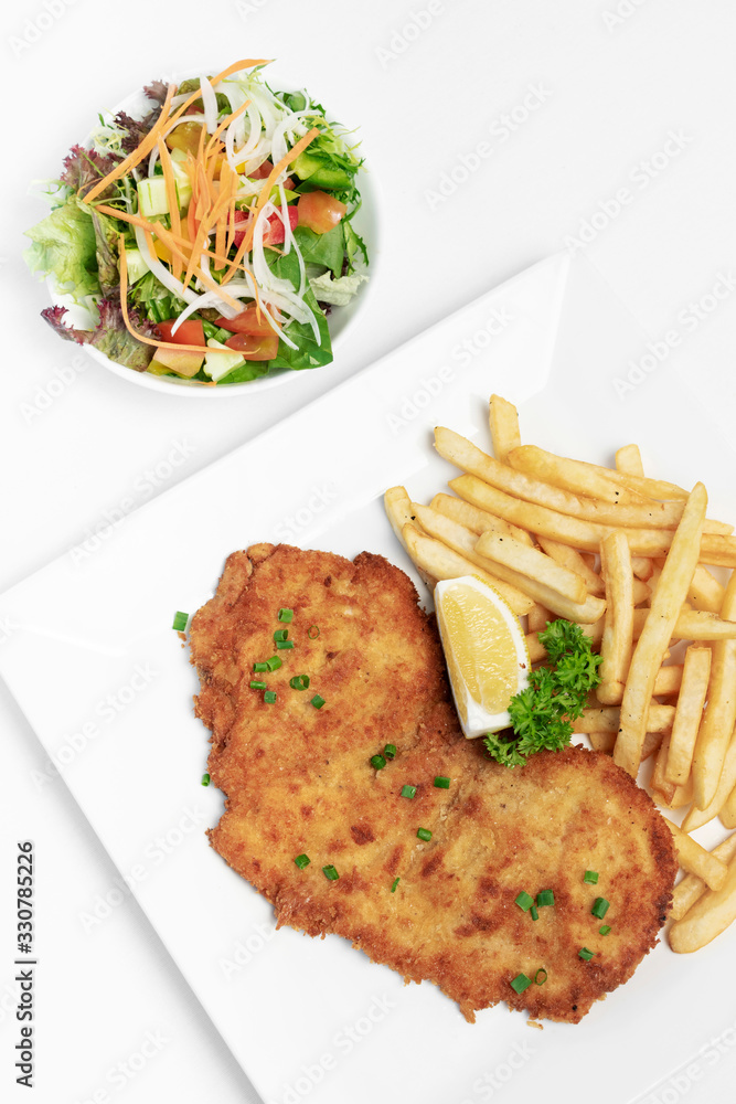 german breaded pork schnitzel with french fries Stock Photo Adobe Stock