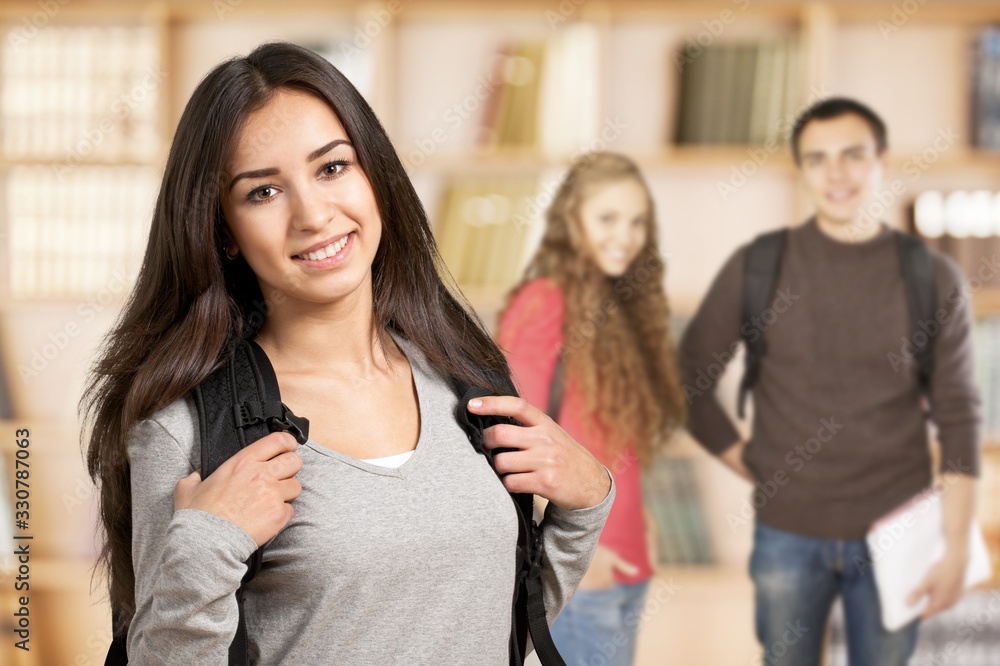 Obraz premium Portrait of a cute young student girl