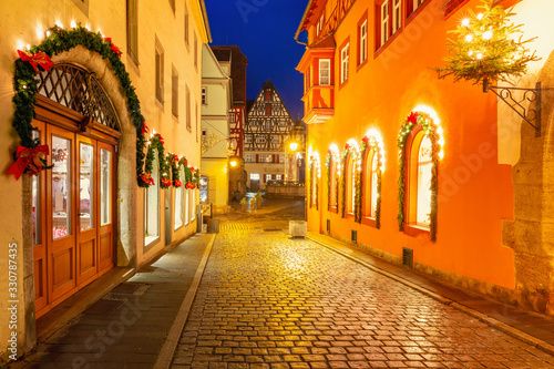 Decorated and illuminated Christmas night street in medieval Old Town of Rothenbur ob der Tauber, Bavaria, southern Germany