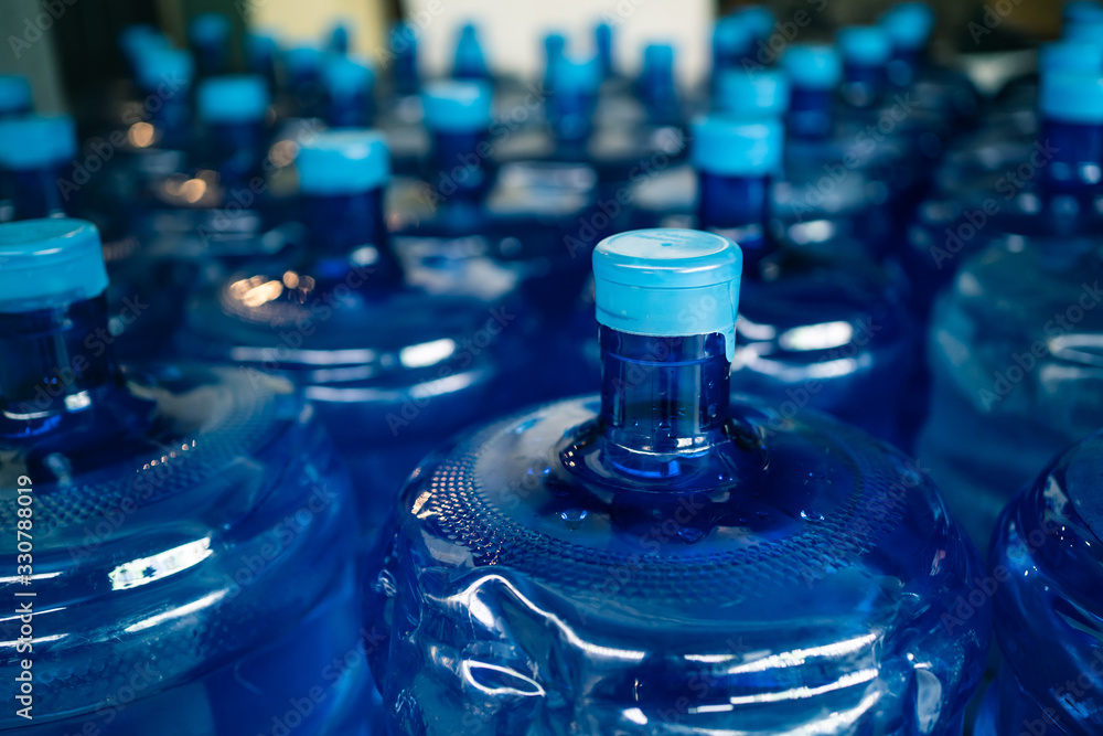 A pile of large drinking water bottles Stock Photo | Adobe Stock