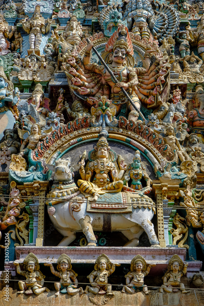 Madurai, India - March 2020: Detail of the gopuram of the Hindu Meenakshi Amman Temple on March 10, 2020 in Madurai, India.