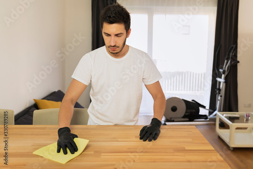 The husband helps his wife with household chores. photo