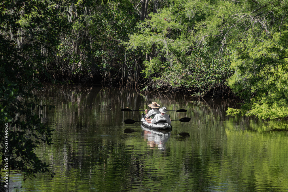People enjoy canoeing on the river