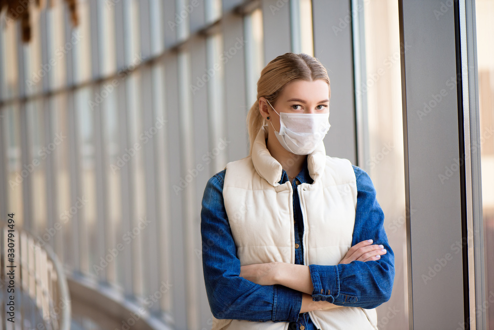 Coronavirus and Air pollution pm2.5 concept. Woman using mask for protection pm2.5 in airport terminal.Wuhan coronavirus and epidemic virus symptoms Coronavirus and Air pollution pm2.5 concept. Woman using mask for protection pm2.5 in airport terminal.Wuhan coronavirus and epidemic virus symptoms