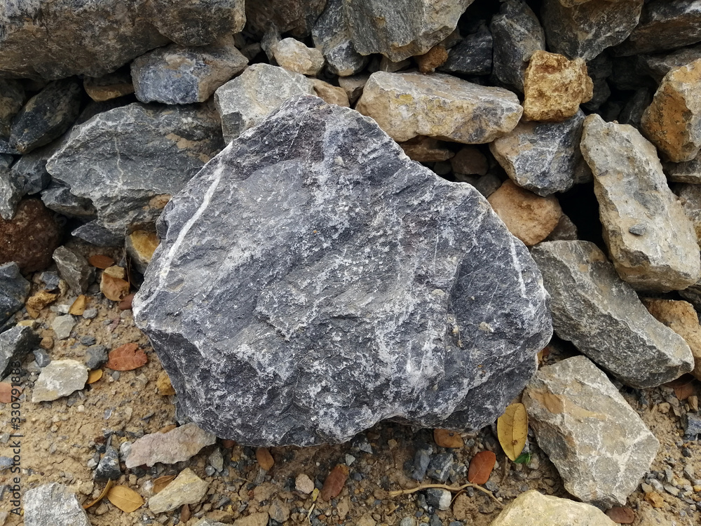 Limestone rock on nature background. Limestone is a sedimentary rock composed mostly of the mineral calcite, It is a basic building block of the construction industry.