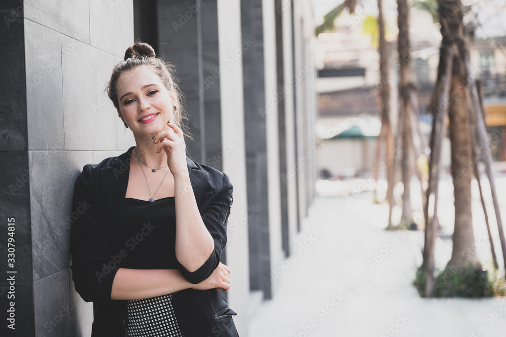 Portrait of a successful business woman smiling. Beautiful young female executive in an urban setting Portrait of a successful business woman smiling. Beautiful young female executive in an urban setting
