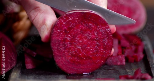 Sliced fresh beets on a cutting Board.