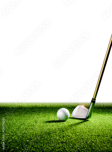 Vertical image with golf club and golf ball on the turf with white wall in the background