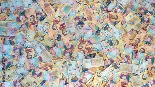 Throwing Venezuelan money on the floor. Venezuella.