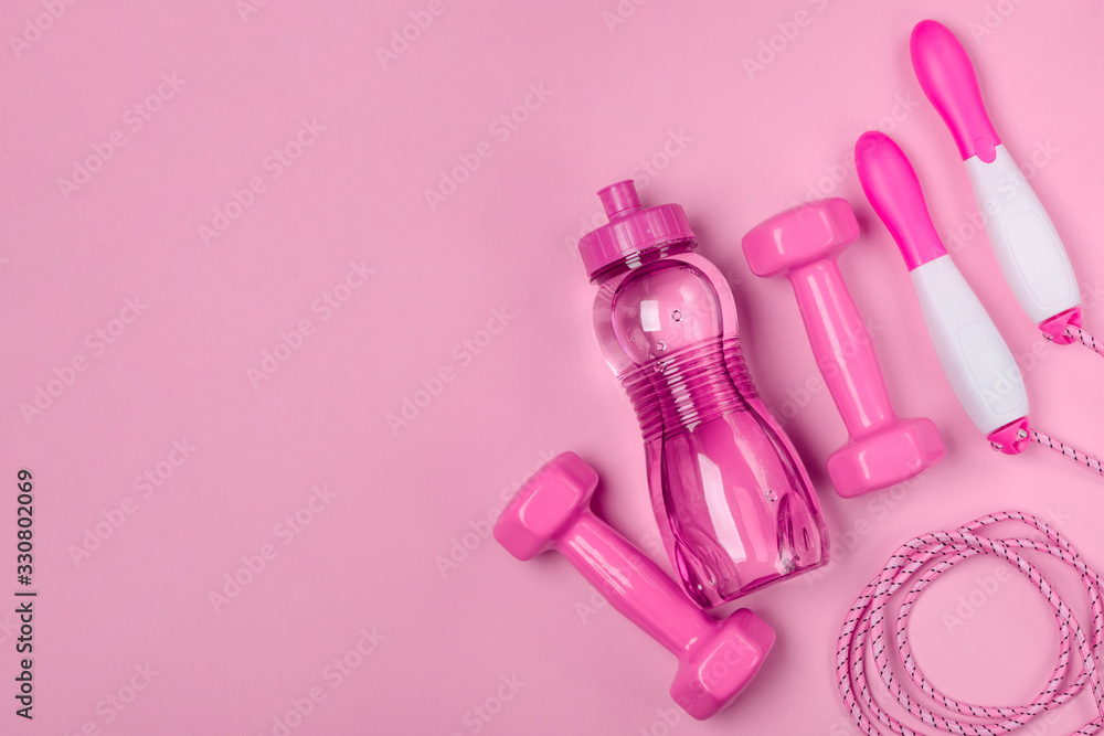 Jump rope, bottle of water and dumbbells