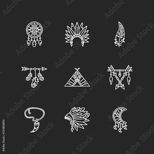 Native american indian accessories chalk white icons set on black background. Boho style dreamcatcher. Necklace with tooth, arrow with feathers. Isolated vector chalkboard illustrations