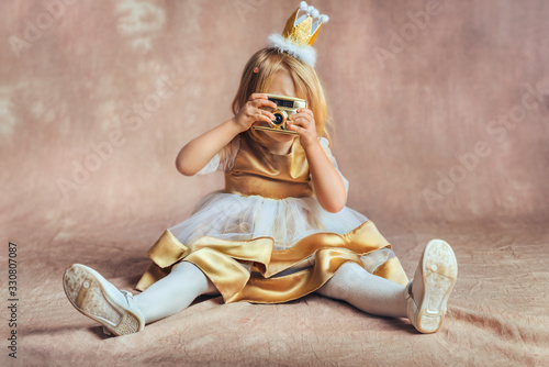 fashion photography - Baby girl as a princess holding photo camera