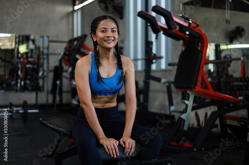 Asian woman in fitness gym