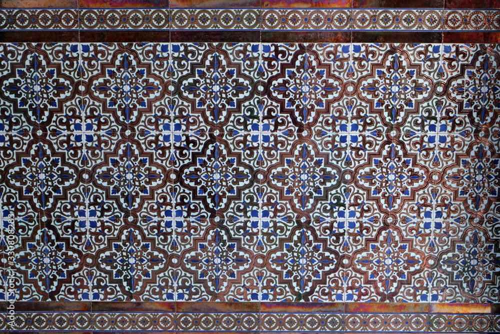 Close-up: sample of a typical Andalusian / Moorish tile pattern in a house entrance; Spain, Europe