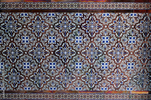 Close-up: sample of a typical Andalusian / Moorish tile pattern in a house entrance; Spain, Europe