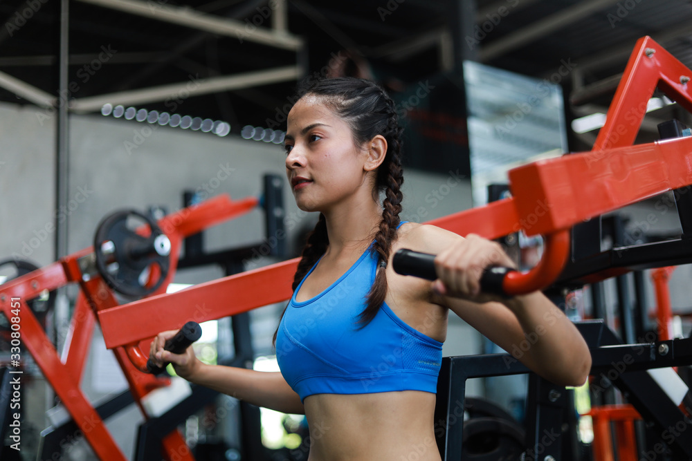Fototapeta premium Asian woman in fitness gym