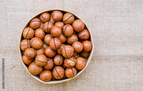 Macadamia nut close up on a burlap background