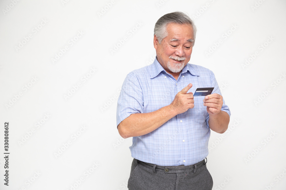 Portrait of senior asian man holding credit card and showing on hand isolated on white background Portrait of senior asian man holding credit card and showing on hand isolated on white background