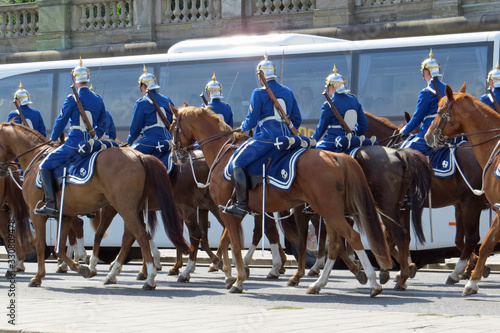 Mounted Royal Guards during changing of the guards ceremony riding behind Stockholm Palace