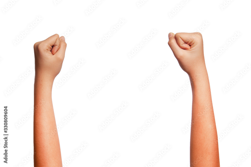 Close-up of a woman's hand and finger on a white background - doing the fist sign Close-up of a woman's hand and finger on a white background - doing the fist sign