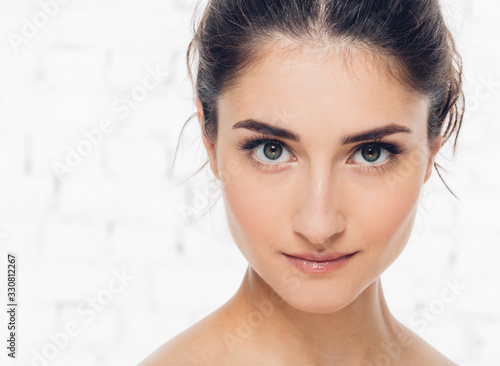 Brunette hair woman clean skin natural make up beautiful eyes cute smile photo