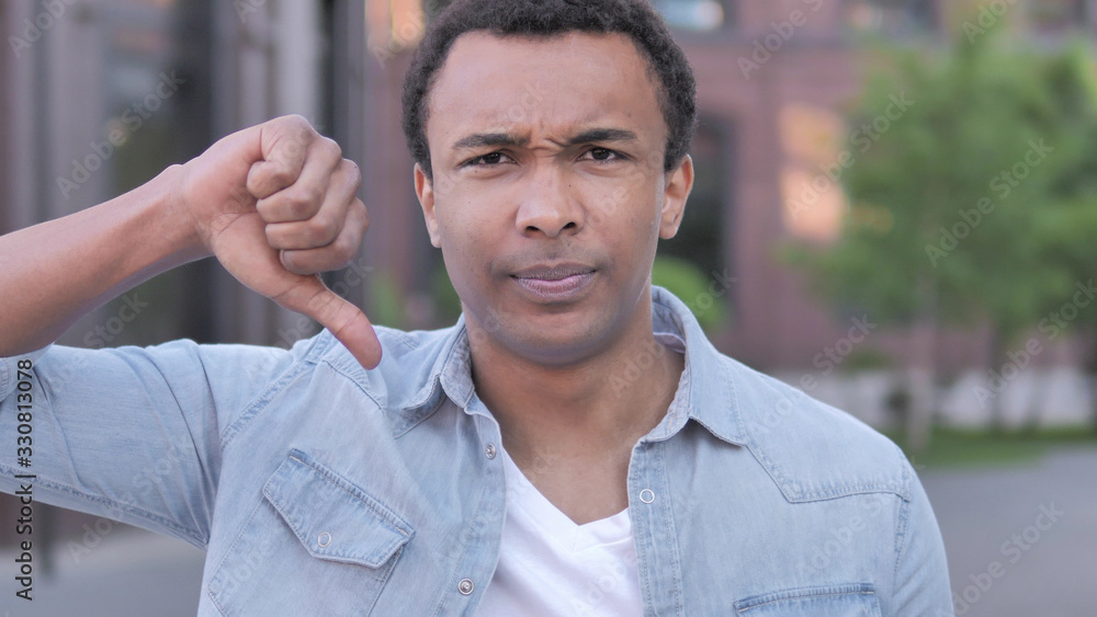 Thumbs Down by African Man, Outdoor Thumbs Down by African Man, Outdoor