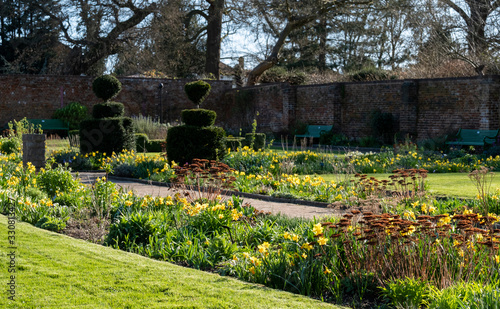 Late afternoon sun, photographed in early spring at Eastcote House historic walled garden in the Borough of Hillingdon, London, UK