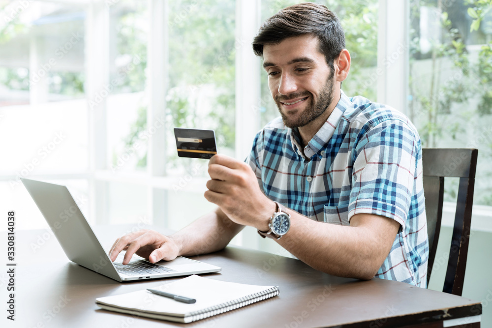 Business and financial concepts, Young men buy goods and make financial transactions online. Business and financial concepts, Young men buy goods and make financial transactions online.