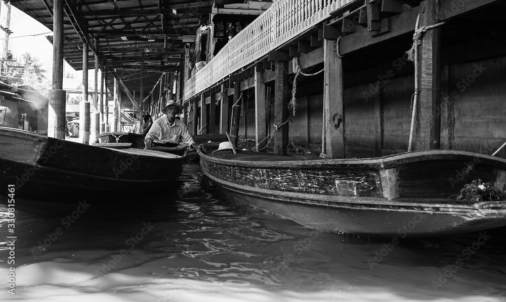boats on the river in black and white