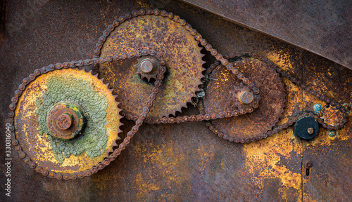 Gears and chains on old abandoned farm equipment