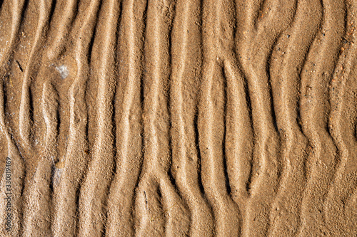 Contrast sand texture.Dented wave of the blow of the wind. photo