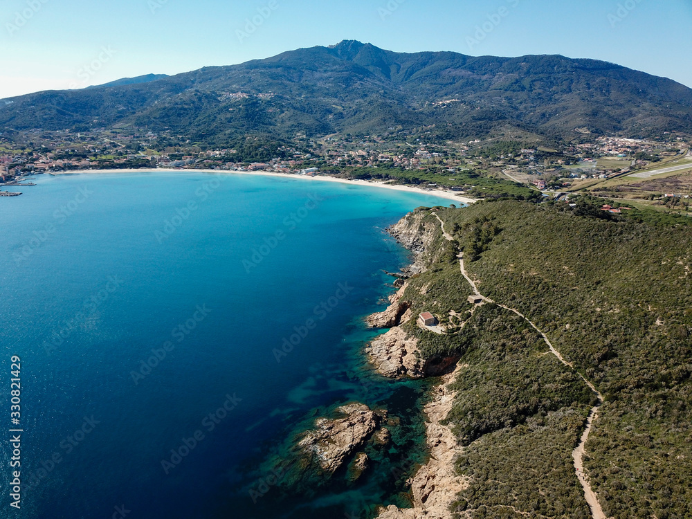 Drone view of Marina di Campo gulf, Elba island, Italy