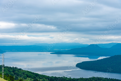 Lake Kussharo in summer season sunny day. Natural landscape from Bihoro-toge pass lookout view point. Akan Mashu National Park, Hokkaido, Japan