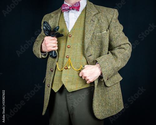 Portrait of Successful Businessman in Vintage Tweed Suit Holding Leather Gloves. Retro Sartorial Excellence. Stylish English Gentleman. Feel the Need for Tweed. 