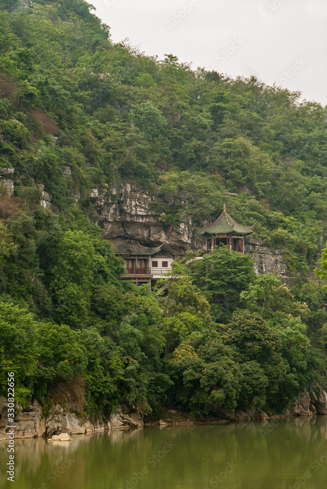 Closeup of traditional buildings on slope along Xiadong, Guilin, China.
