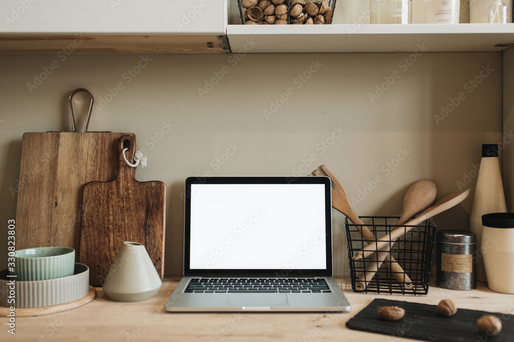 Workspace with mockup blank copy space screen laptop in kitchen. Modern stylish interior design. Front view blog, social media, website hero header template. Workspace with mockup blank copy space screen laptop in kitchen. Modern stylish interior design. Front view blog, social media, website hero header template.
