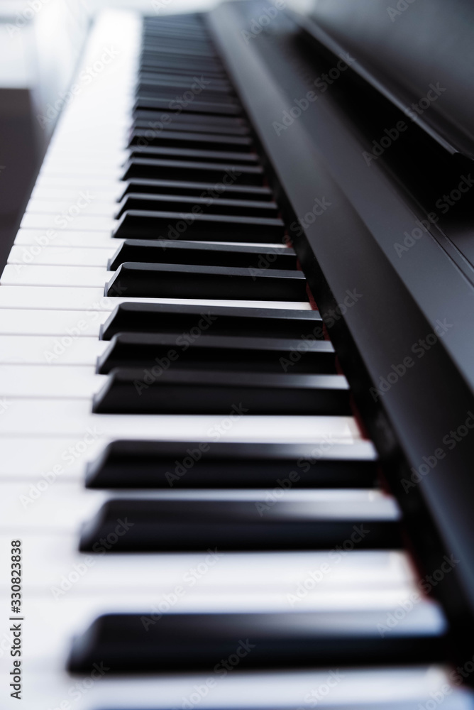 Close-up of electric piano keys, shallow depth of field. Music industry. Copy space Close-up of electric piano keys, shallow depth of field. Music industry. Copy space