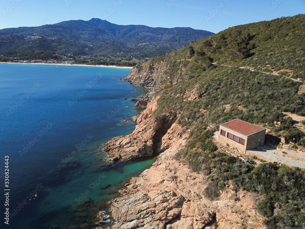 Drone view of Marina di Campo gulf and coastline, Cala Ischia, Elba island, Italy