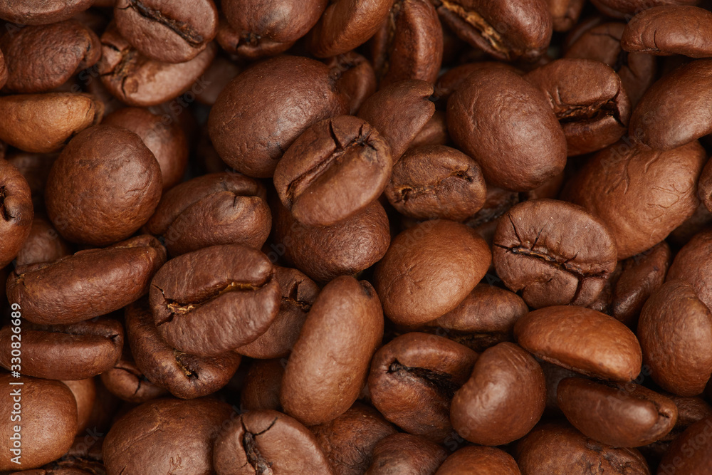 Photo of coffee beans, solid background, roasted coffee beans, texture of roasted coffee beans, high quality, close-up