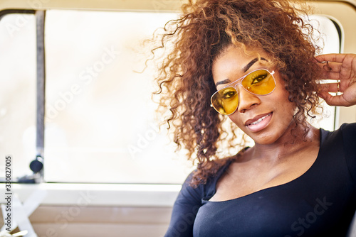 Tablou pe pânză edgy african american model posing in vintage vehicle interior