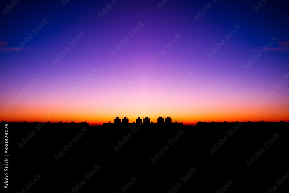 colorful sunset against the backdrop of the city landscape