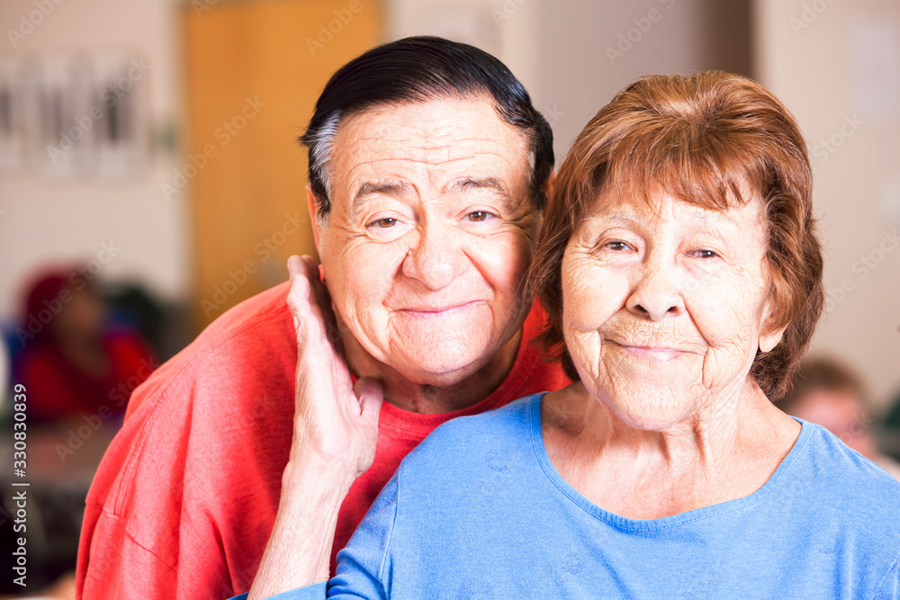 Smiling Hispanic Couple in a Senior Center Smiling Hispanic Couple in a Senior Center