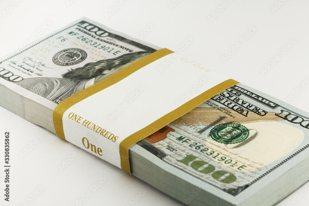 Stack of american money, one hundred dollar cash banknotes on white background, lot of one hundred dollar bills Stack of american money, one hundred dollar cash banknotes on white background, lot of one hundred dollar bills