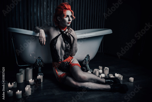Vampire in underwear in a blood bath